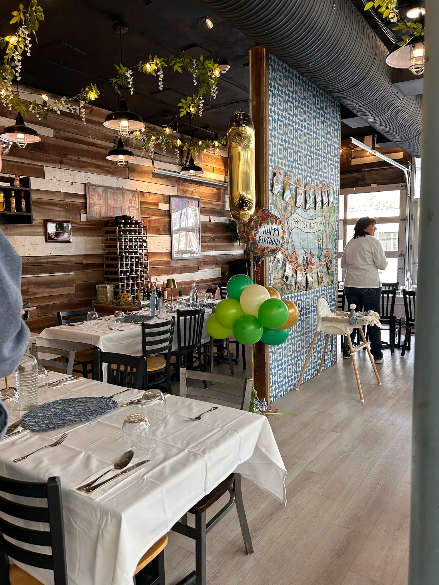 Cozy restaurant interior with festive decorations and balloons