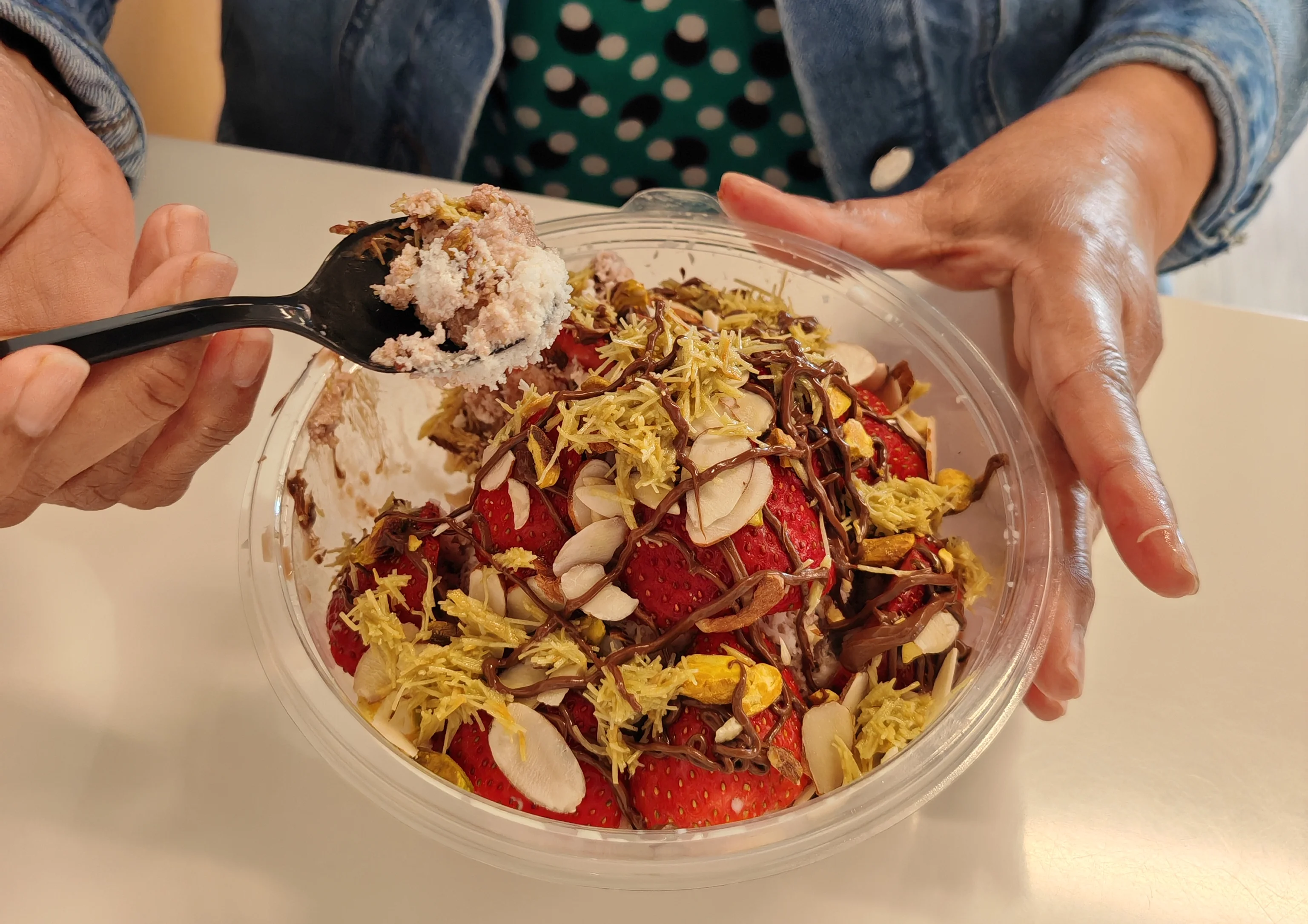 A dessert beverage topped with whipped cream and garnished with a cookie, showcasing caramel swirls.