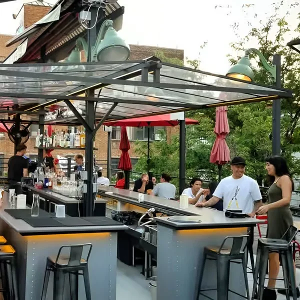 Modern rooftop bar with patrons enjoying drinks
