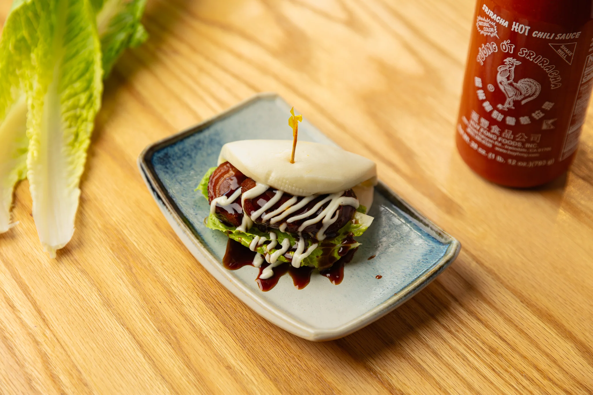 Steamed bao bun with pork and lettuce