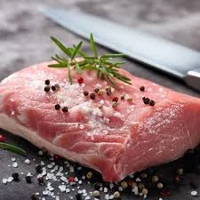 A beautifully plated Wild Boar Strip steak with garnishes.