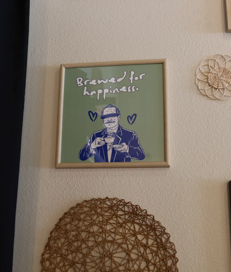 Framed artwork with a cheerful coffee theme
