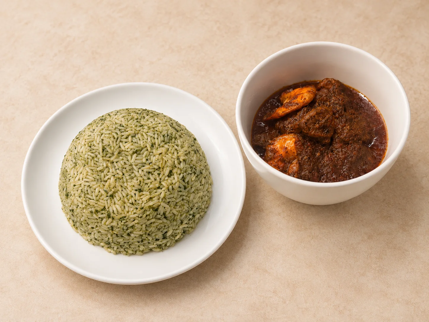 A bowl of green rice shaped into a dome, accompanied by a serving of spicy stew with shrimp.