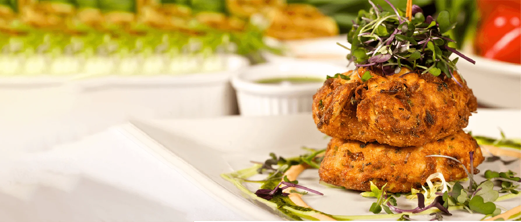 Delicious crabcake served on a plate with garnishes.