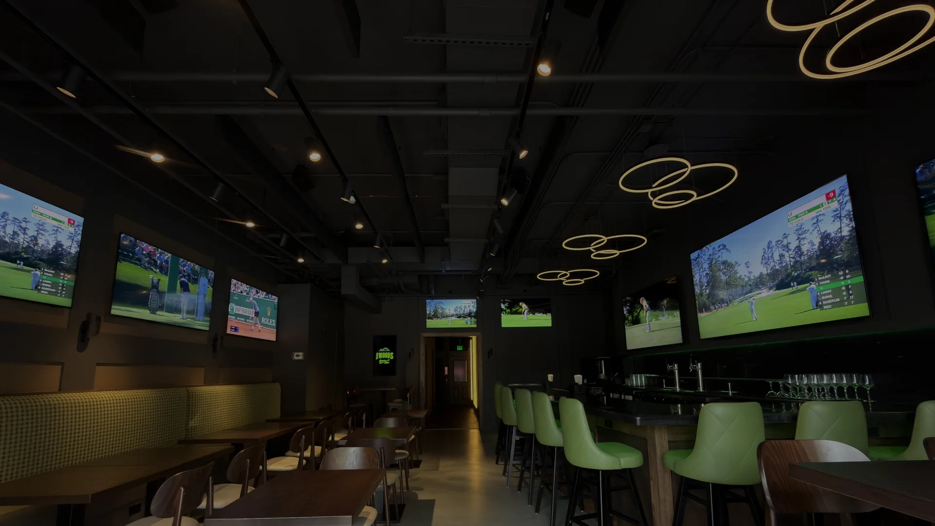 Modern sports bar interior with multiple screens