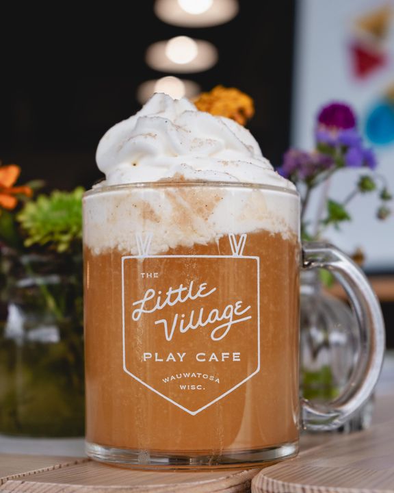 caramel apple cider with a big swirl of topping
