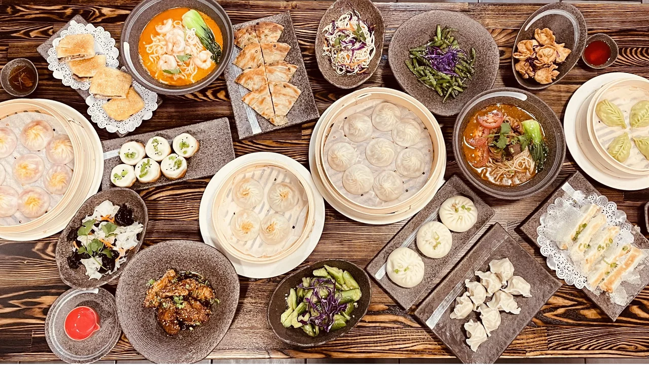 Assorted Chinese dim sum platter with dumplings and noodles