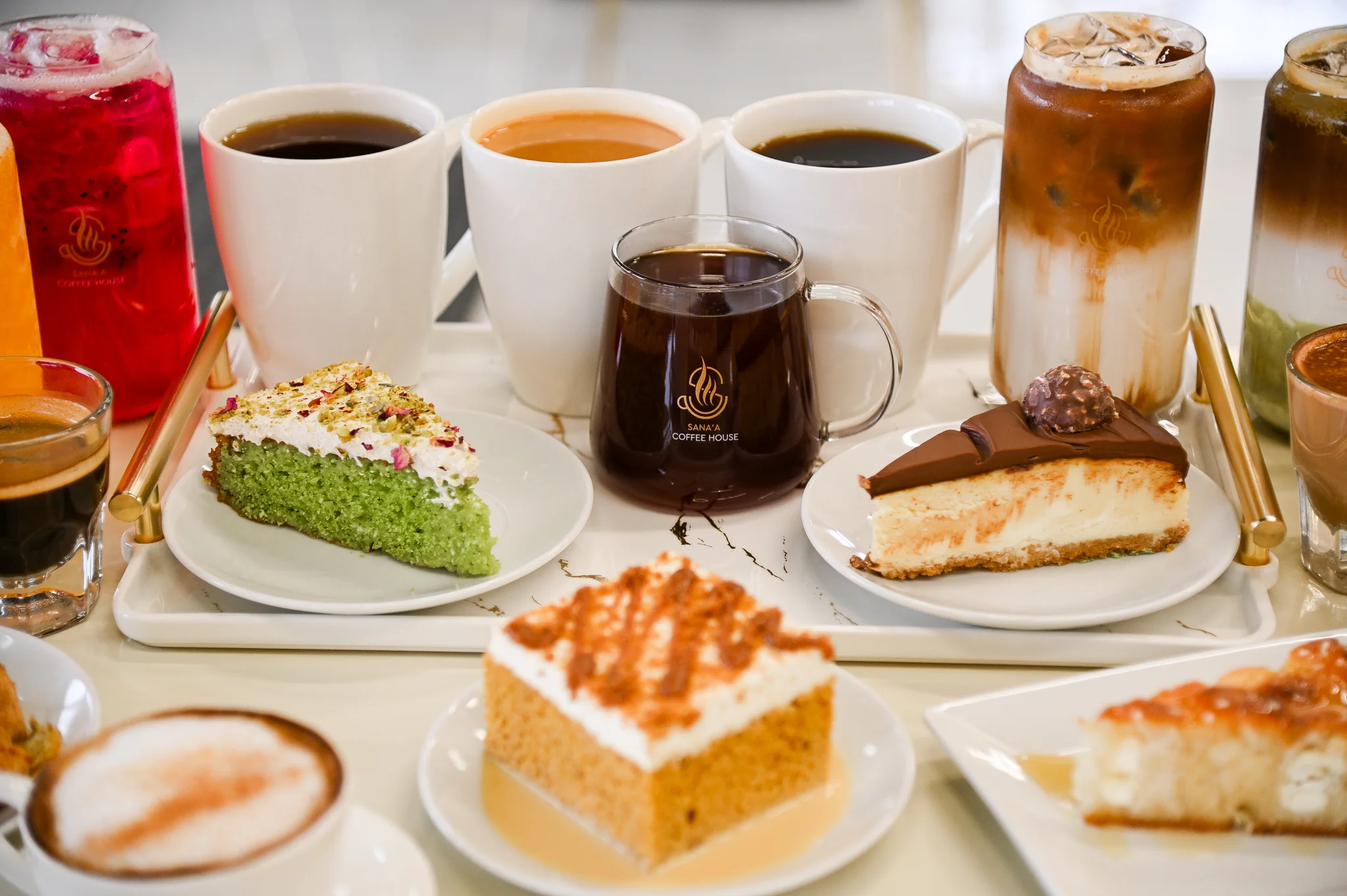 Assorted desserts and coffee at a café