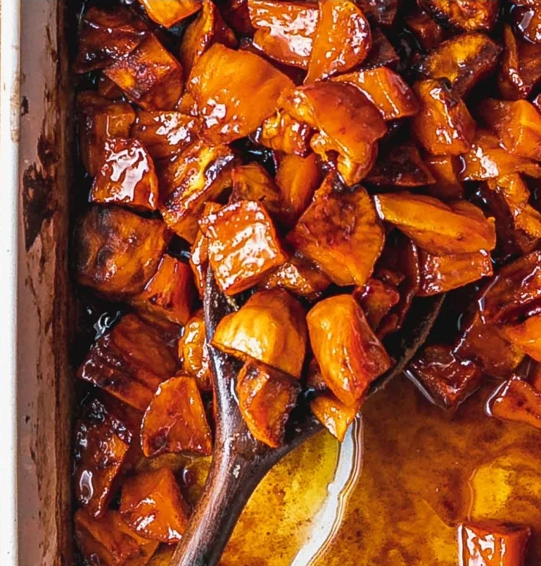 Caramelized sweet potatoes in a rustic dish