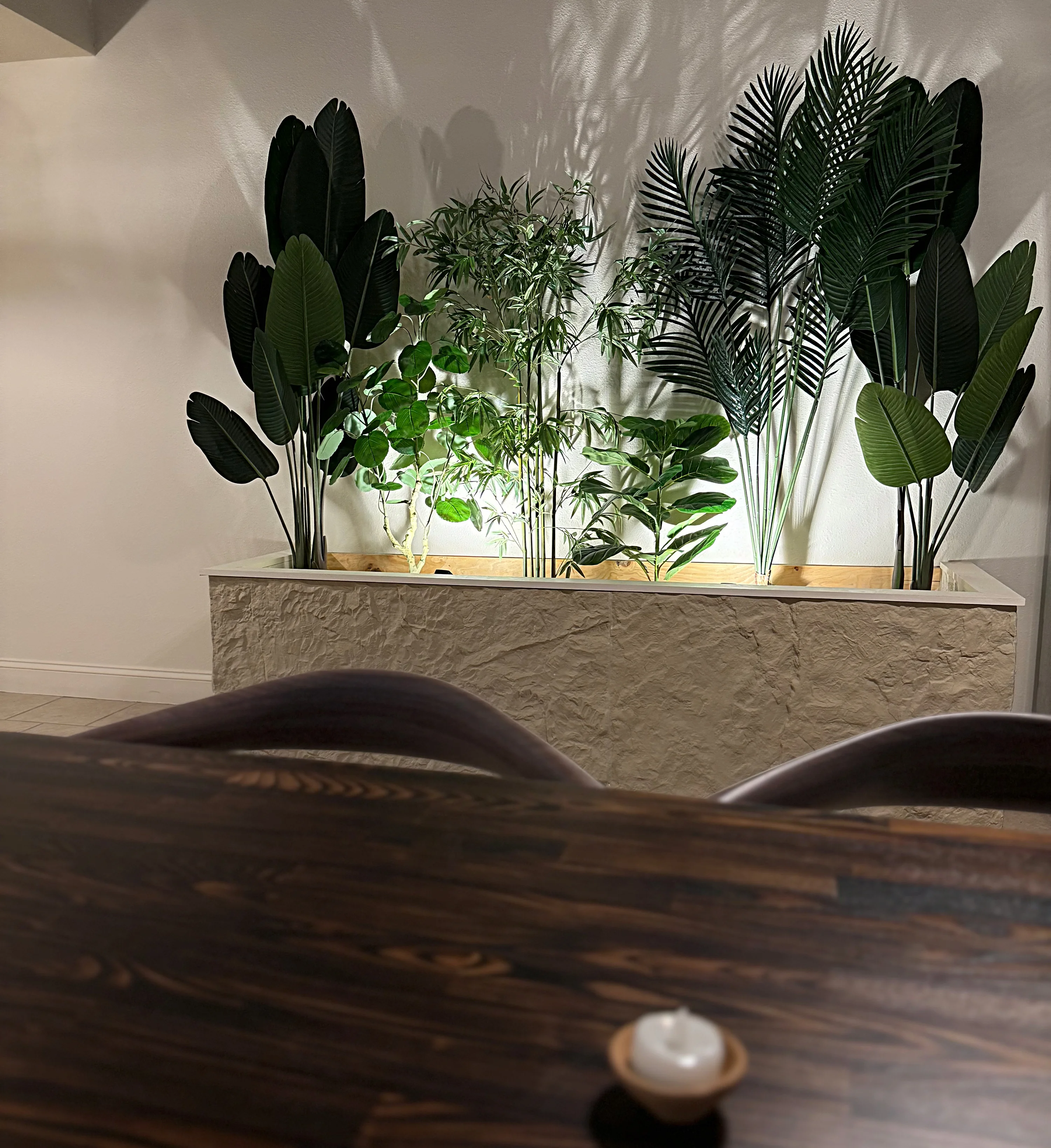 Cozy restaurant interior with lush greenery and warm lighting
