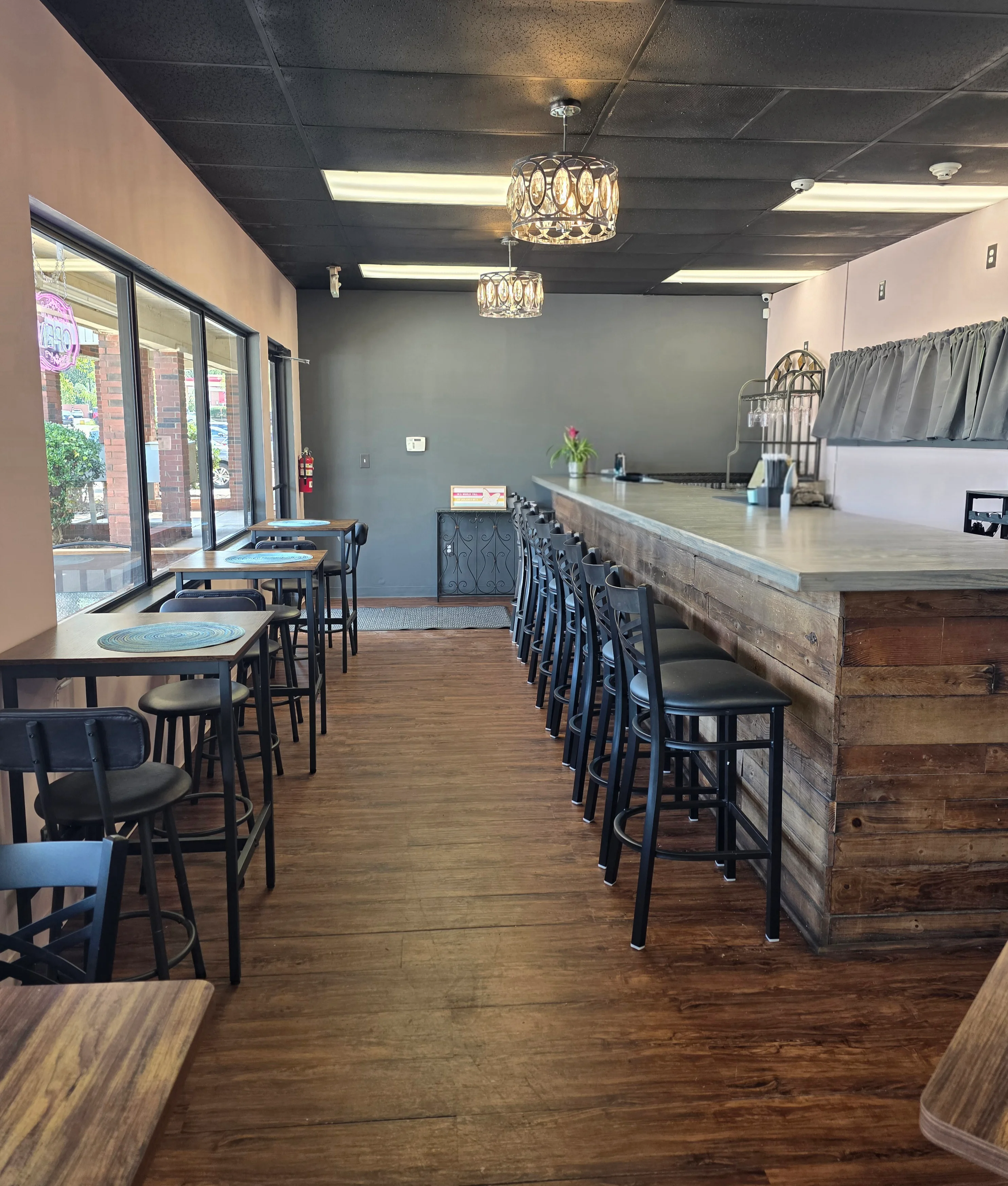 Modern restaurant interior with wooden bar and stylish lighting