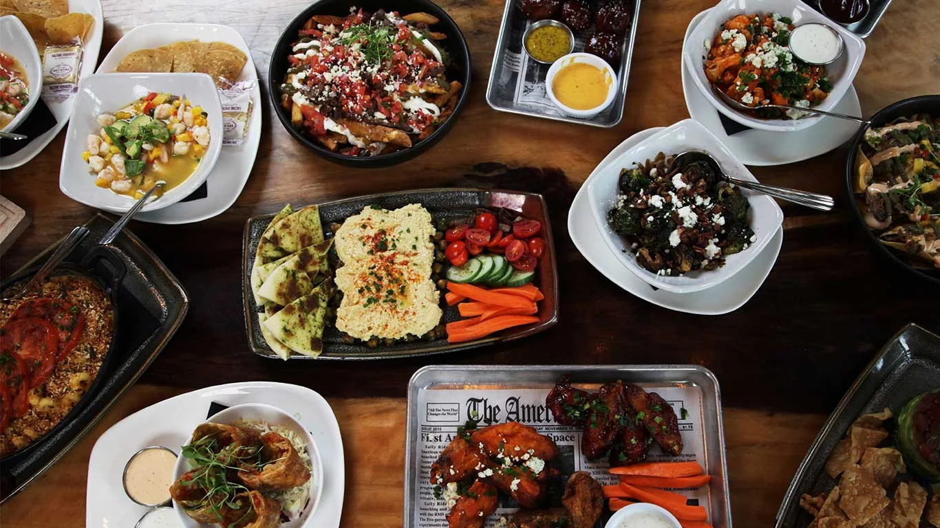 Assorted Latin American dishes on a wooden table