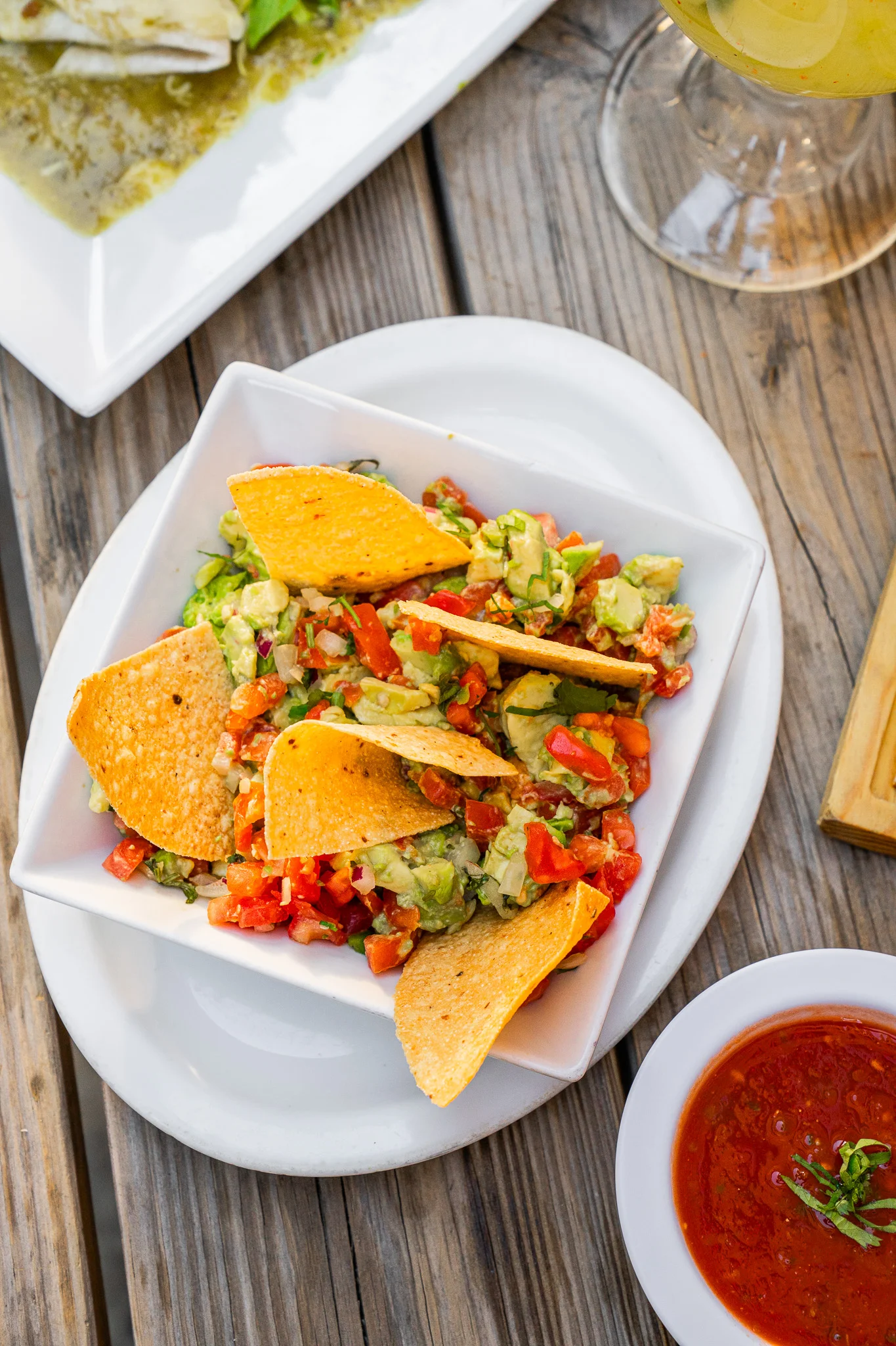 Colorful Mexican guacamole with tortilla chips