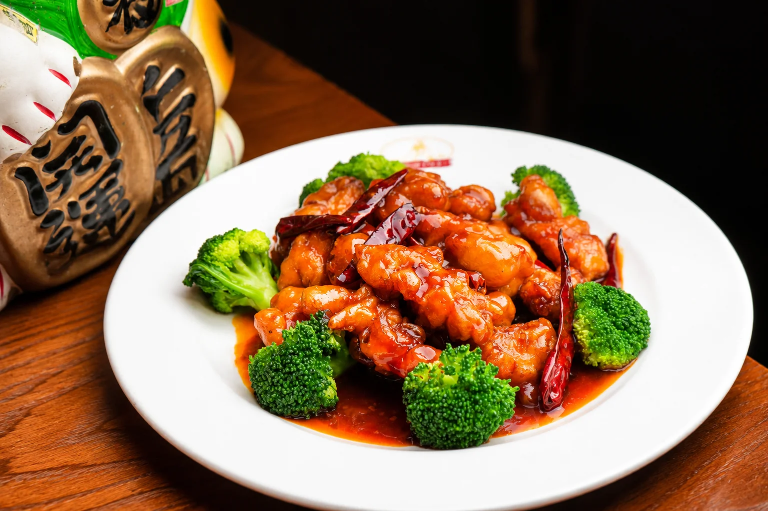 Sweet and sour chicken served with broccoli