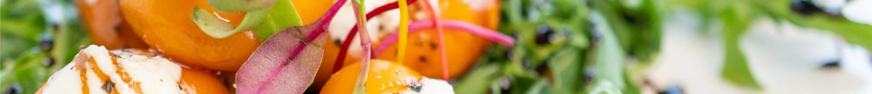 Colorful salad with heirloom tomatoes and microgreens