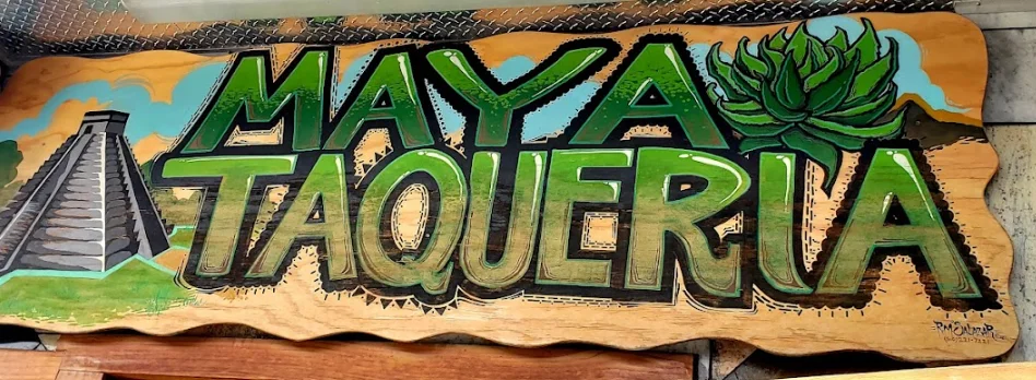 Colorful wooden sign for Maya Taqueria with Mayan pyramid and agave plant