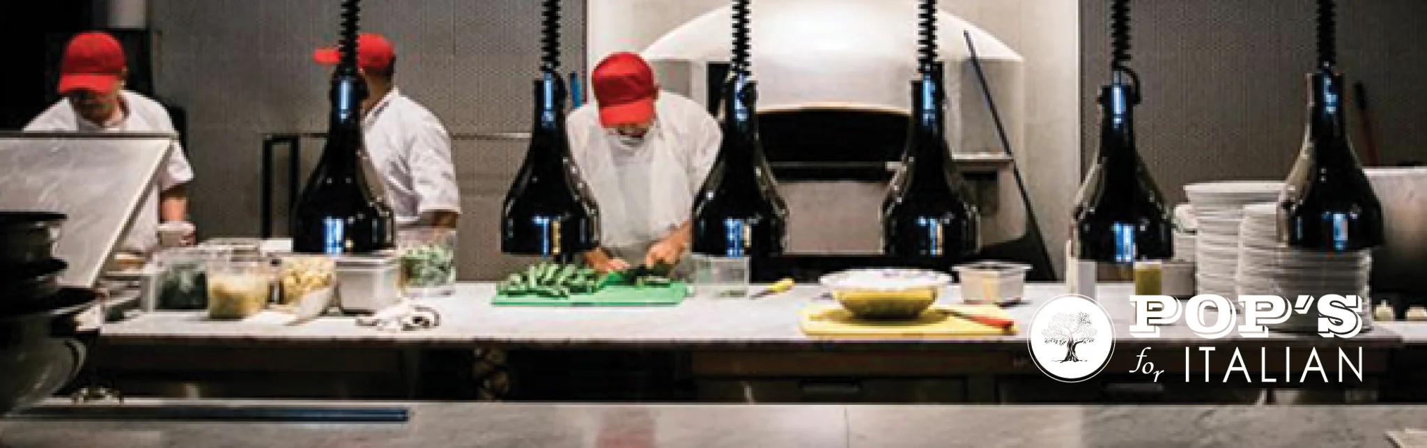 Italian chefs preparing fresh dishes in a modern kitchen