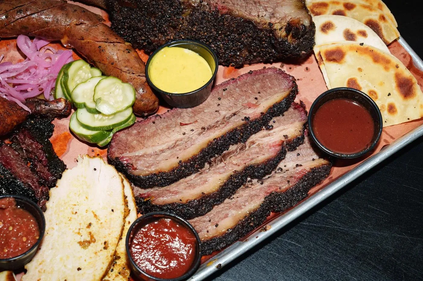 Texas-style barbecue platter with brisket and sausage