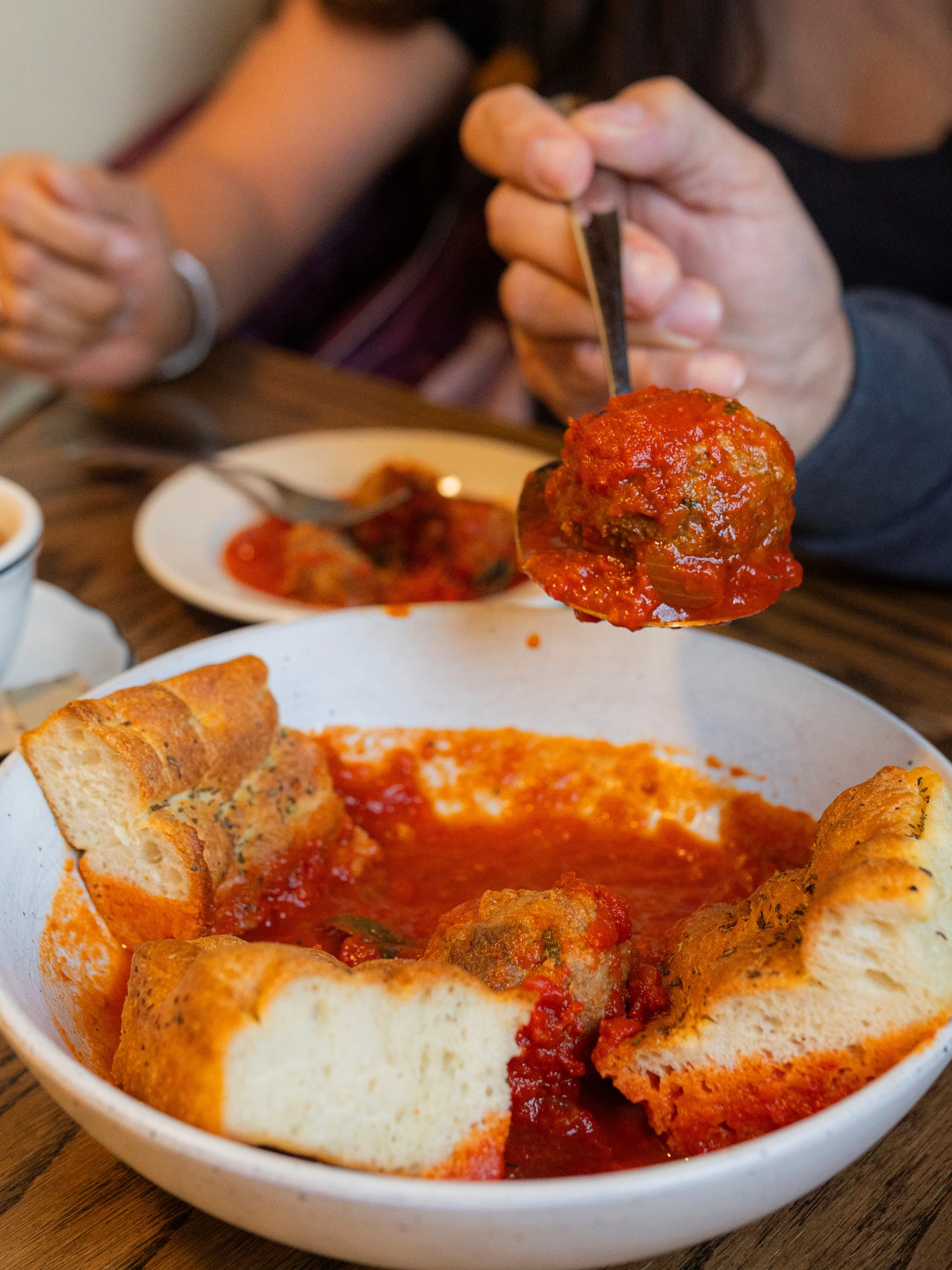 Italian meatballs in marinara sauce with bread