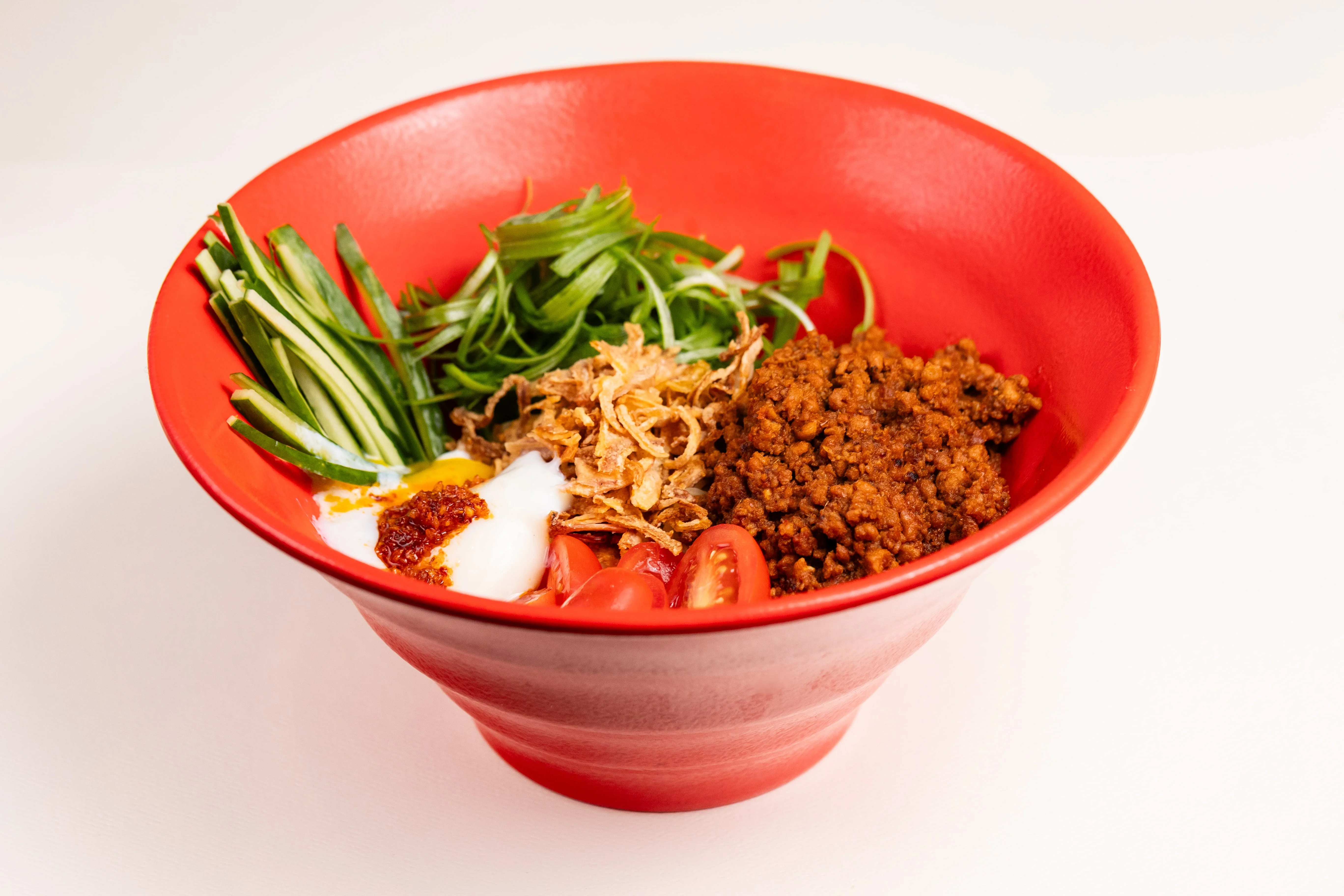 Bowl of Malaysian nasi lemak with toppings