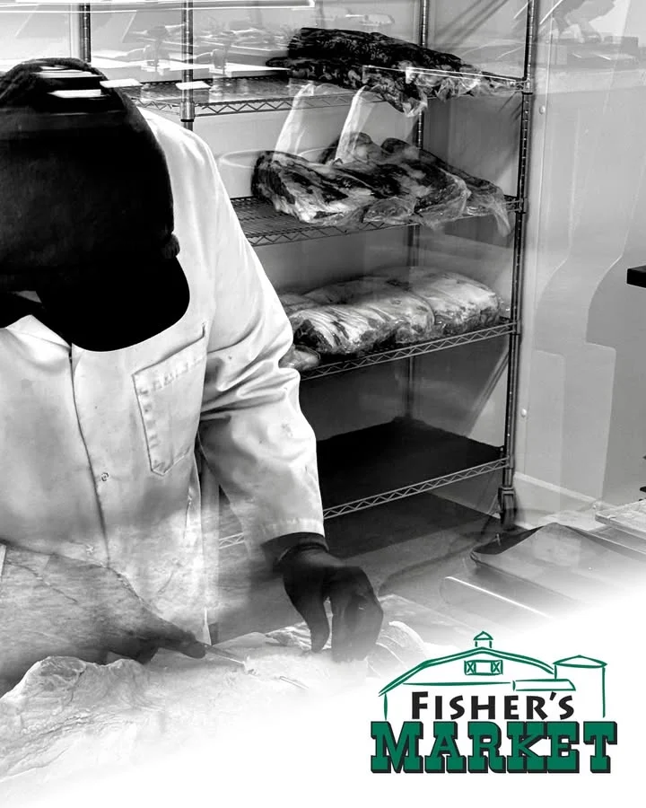 Fishmonger preparing fresh seafood at Fisher's Market
