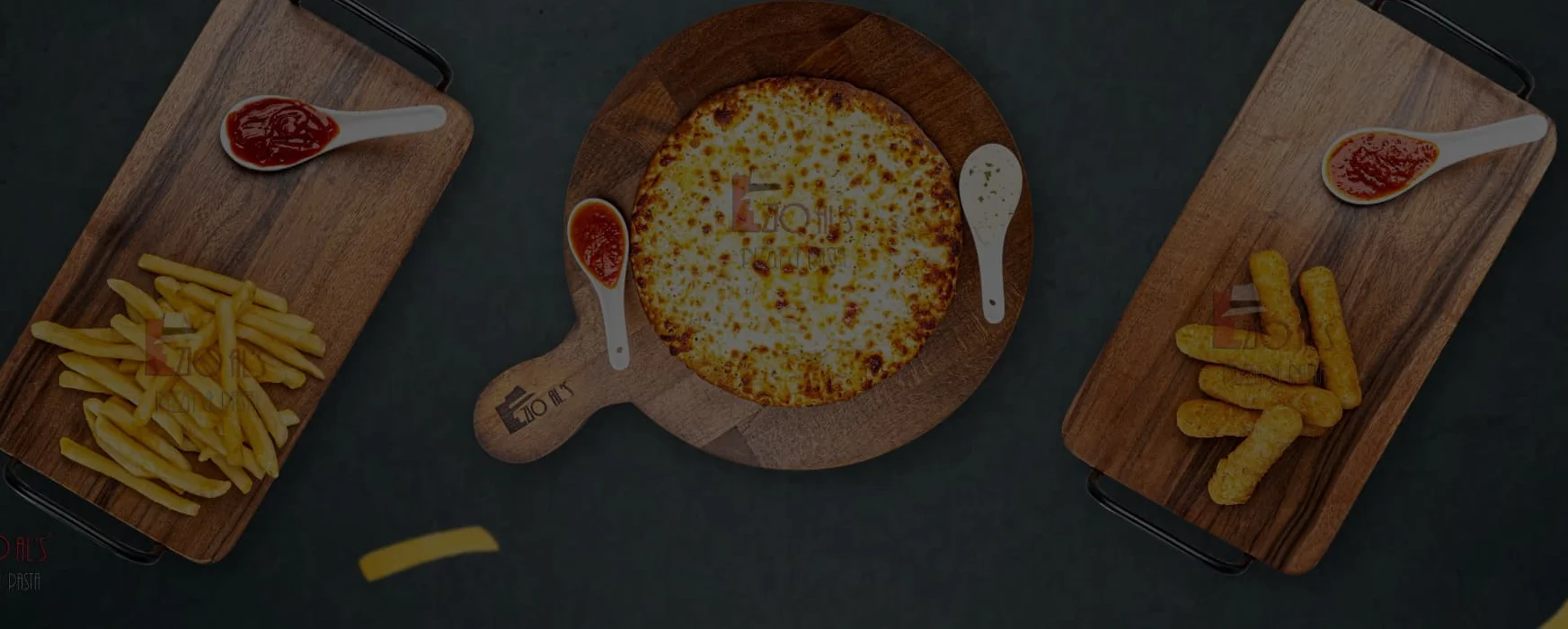 Cheesy pizza with sides of fries and snacks