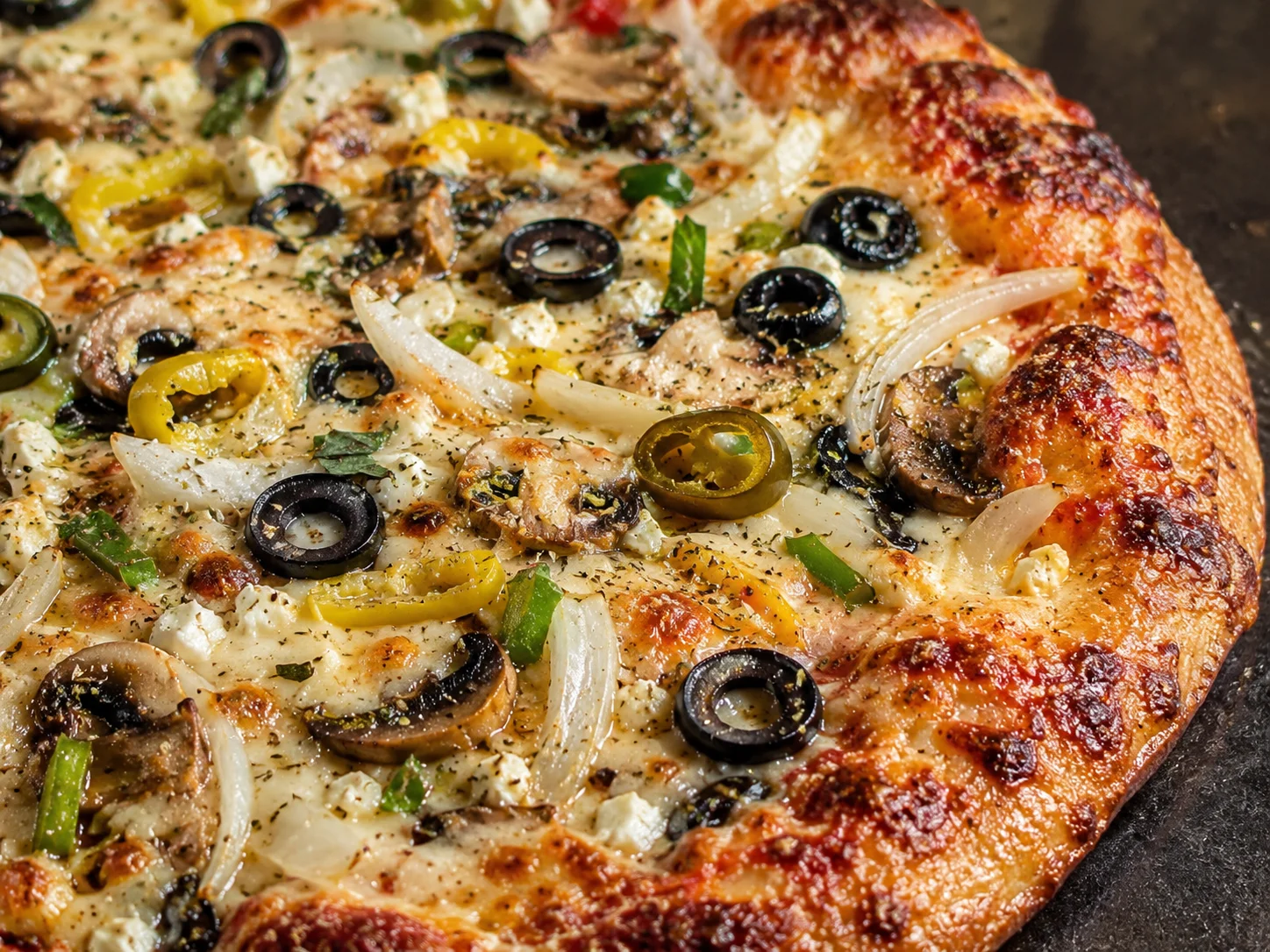 Delicious pepperoni and sausage pizza with green peppers and onions