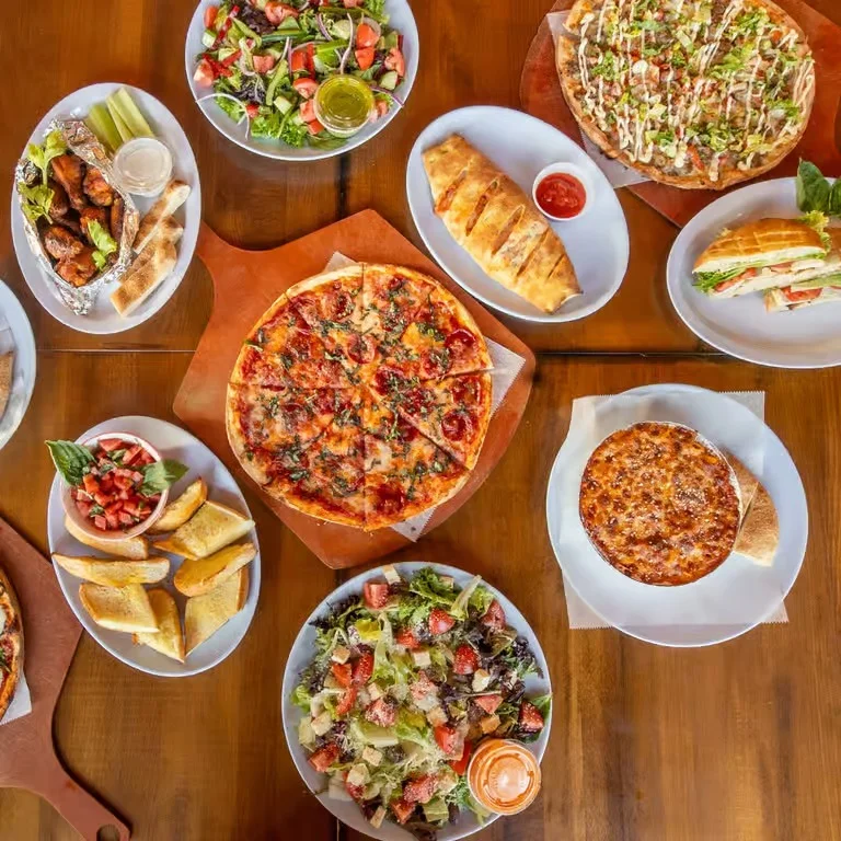 Delicious gourmet burger with fresh toppings on a wooden table