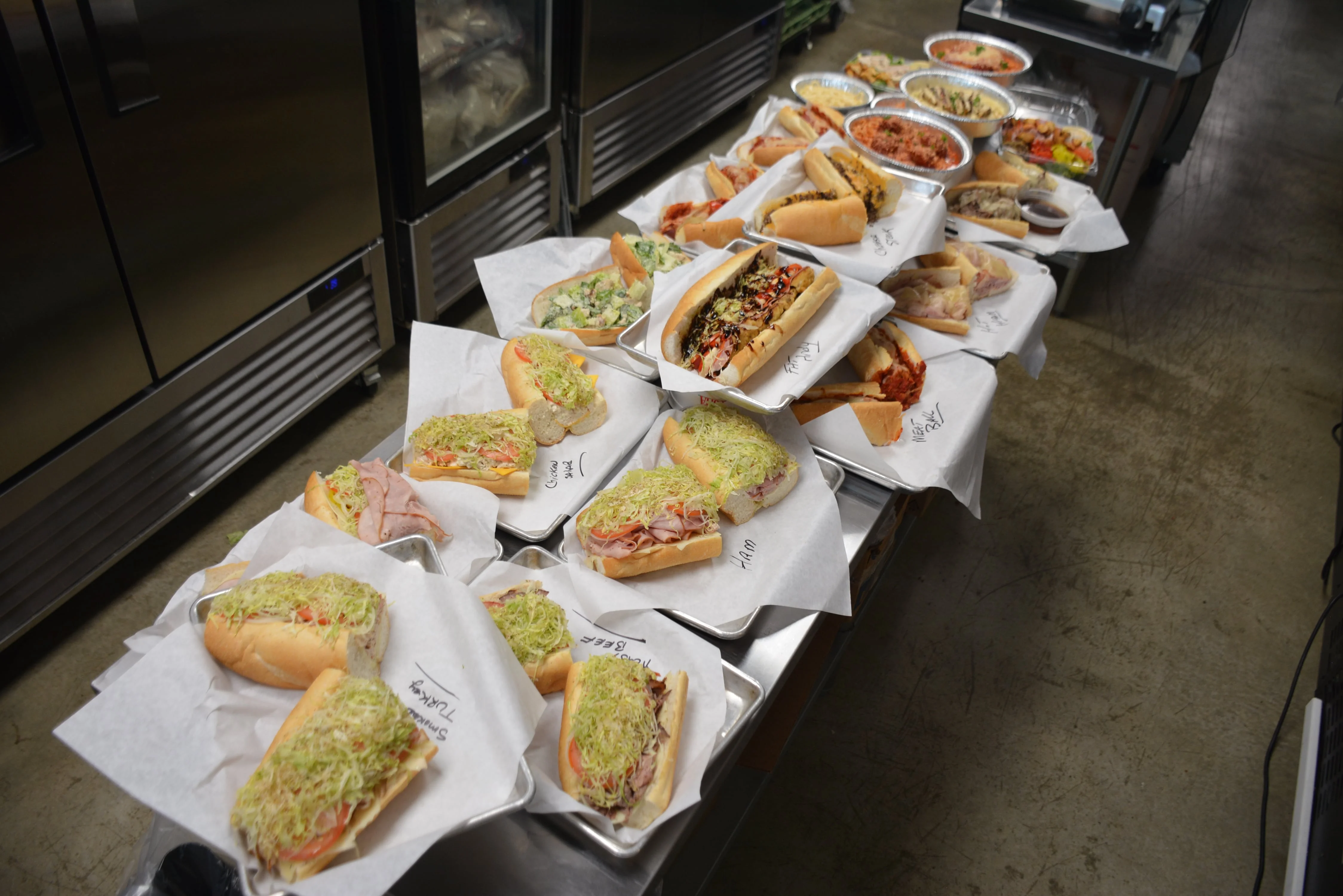 Variety of deli sandwiches on display in a restaurant