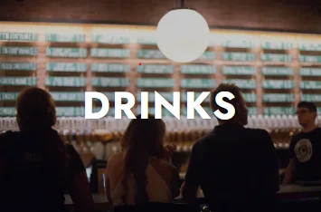 Modern bar scene with drinks menu and patrons