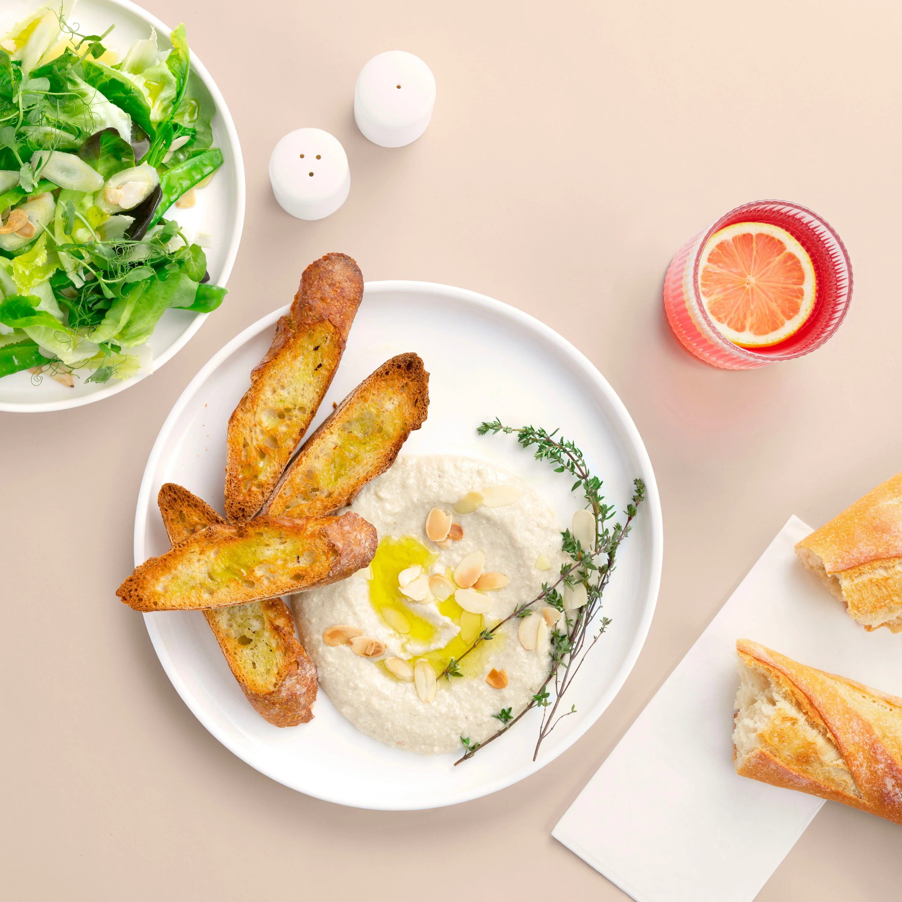 Mediterranean hummus with garlic bread and fresh salad