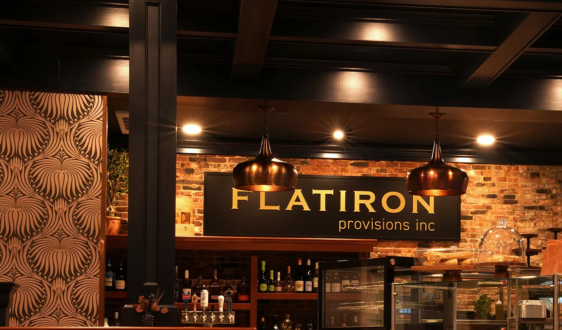 Cozy restaurant interior with exposed brick and warm lighting