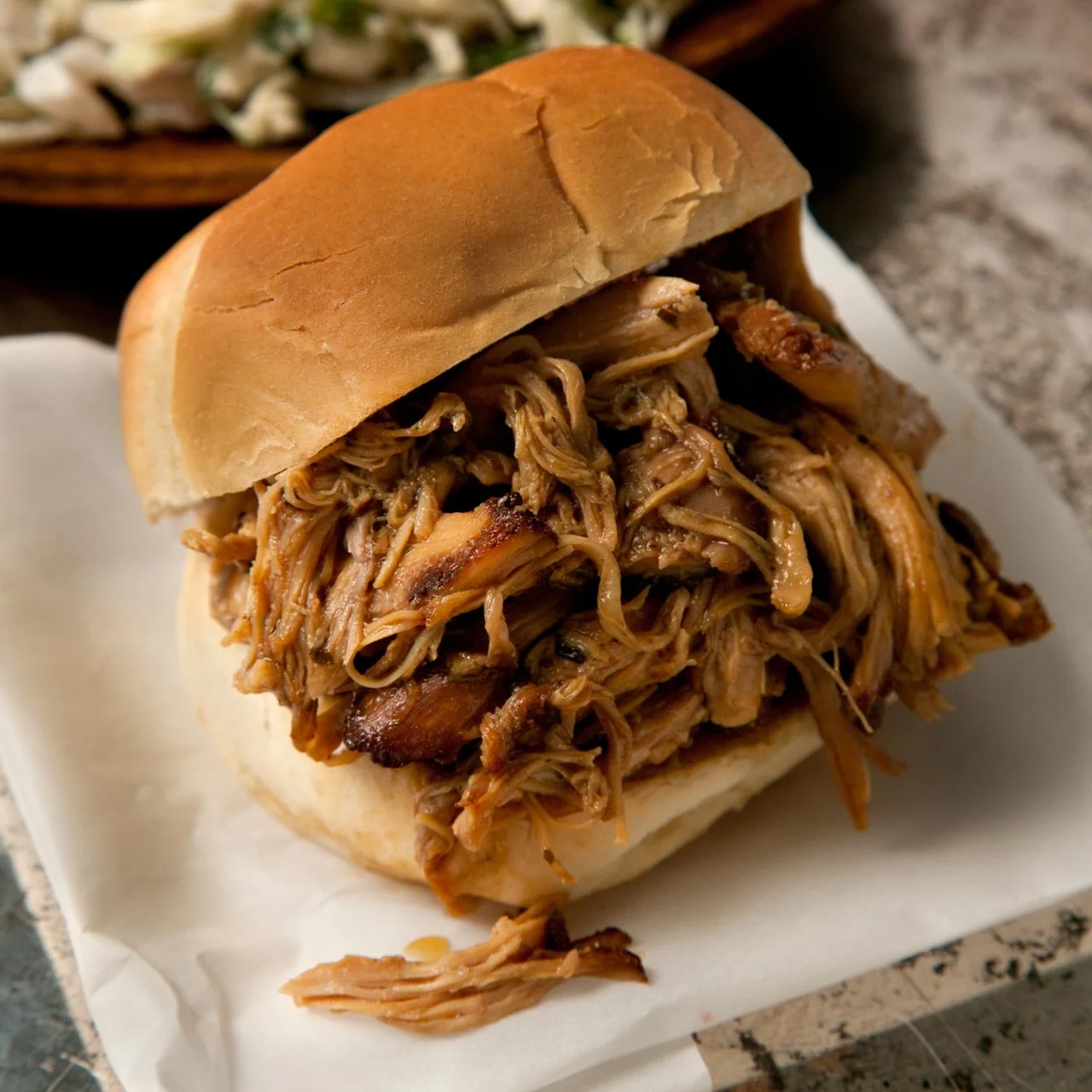 Pulled pork sandwich served on a soft bun