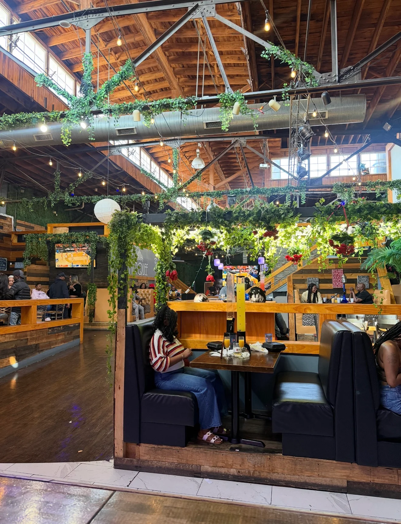 Delicious gourmet burger with fresh toppings on a wooden table