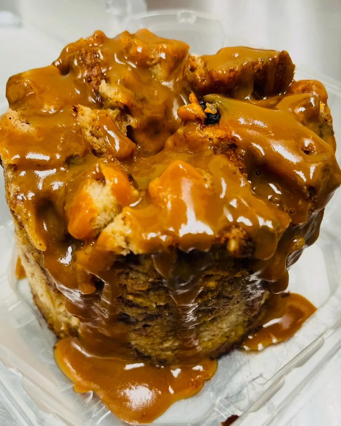 A delicious dessert featuring a soft base topped with a rich, gooey caramel sauce.