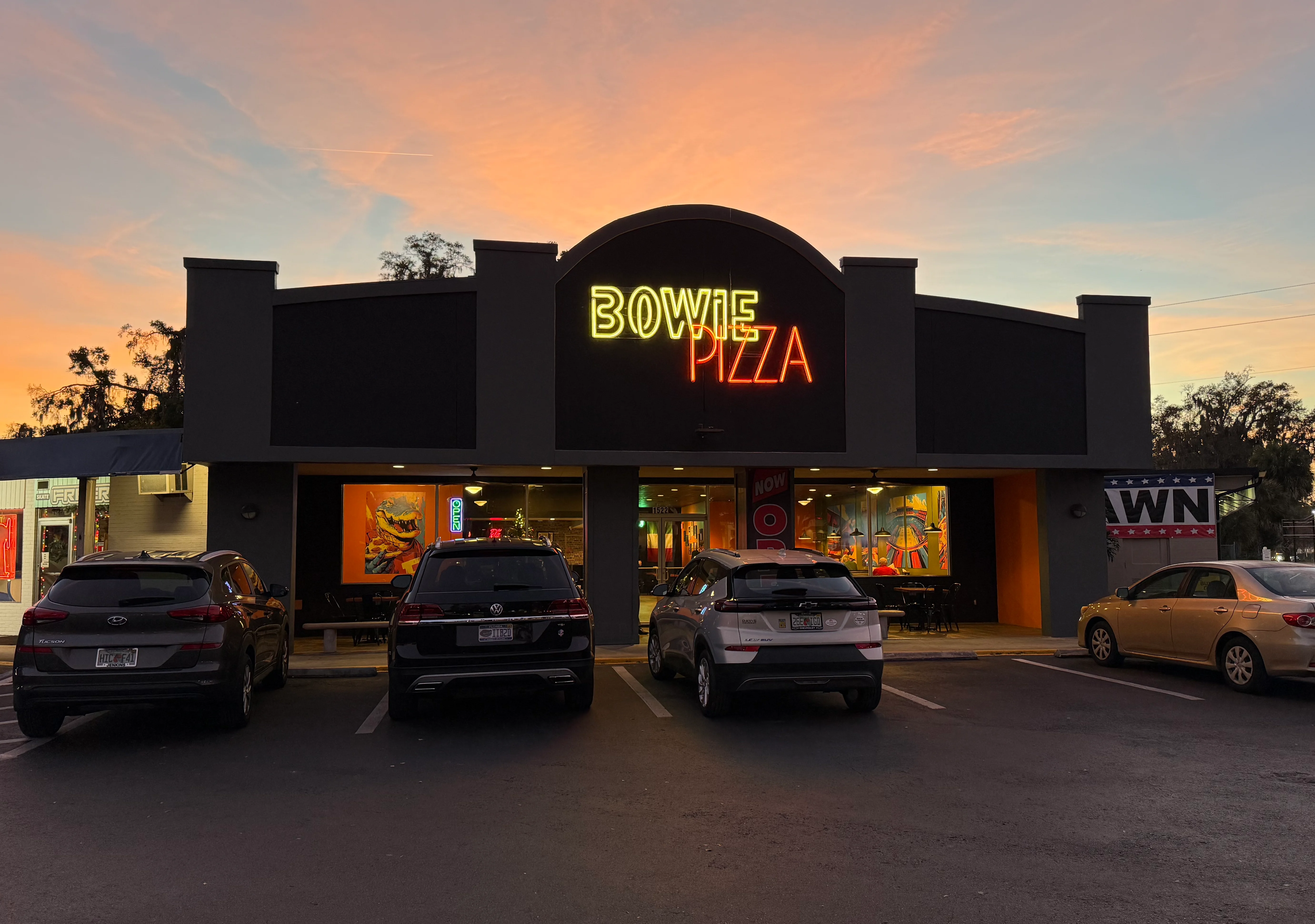 Bowie Pizza restaurant exterior at sunset