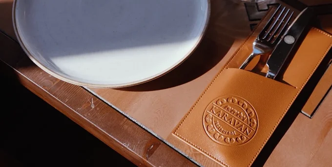 Elegant restaurant table setting with menu and cutlery