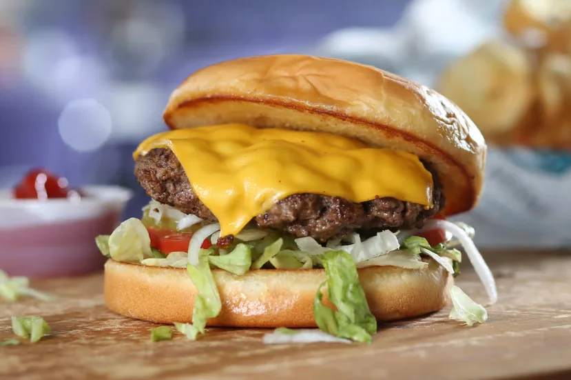 Classic American cheeseburger with lettuce and tomato