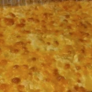 Golden baked macaroni and cheese with a bubbly, cheesy crust on top.