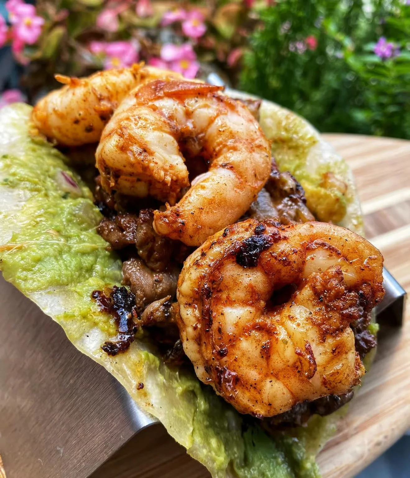 Spicy shrimp tacos with guacamole in a lettuce wrap