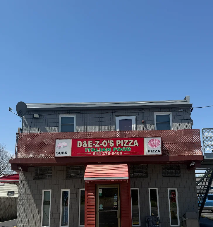 A cartoonish pizza chef figure with a chef's hat presenting a pizza. The background features the name of the pizza establishment in bold letters.