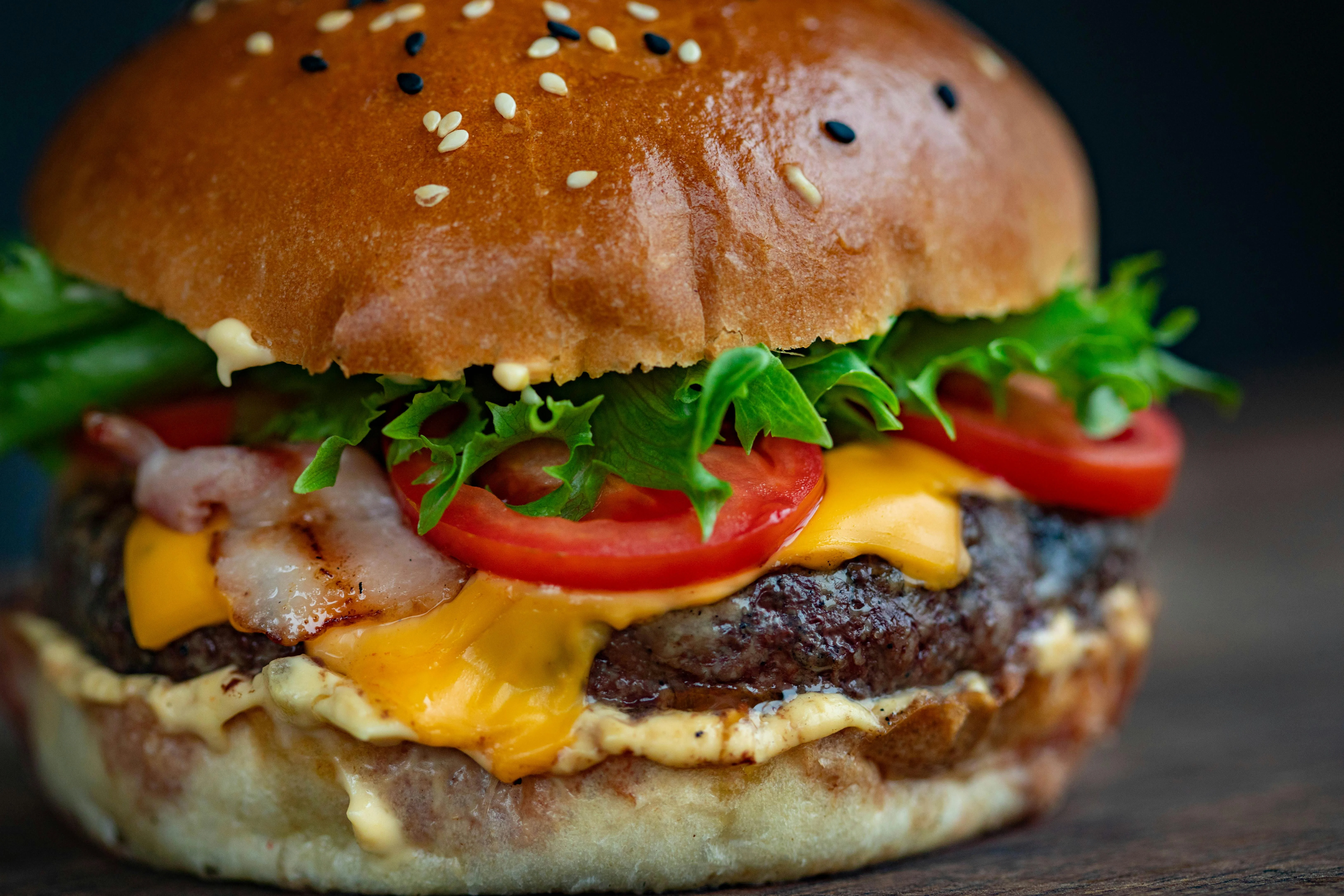Juicy cheeseburger with bacon and fresh toppings