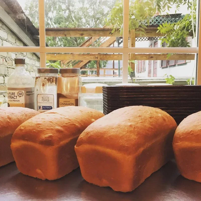 Freshly baked loaves of artisan bread on a kitchen counter