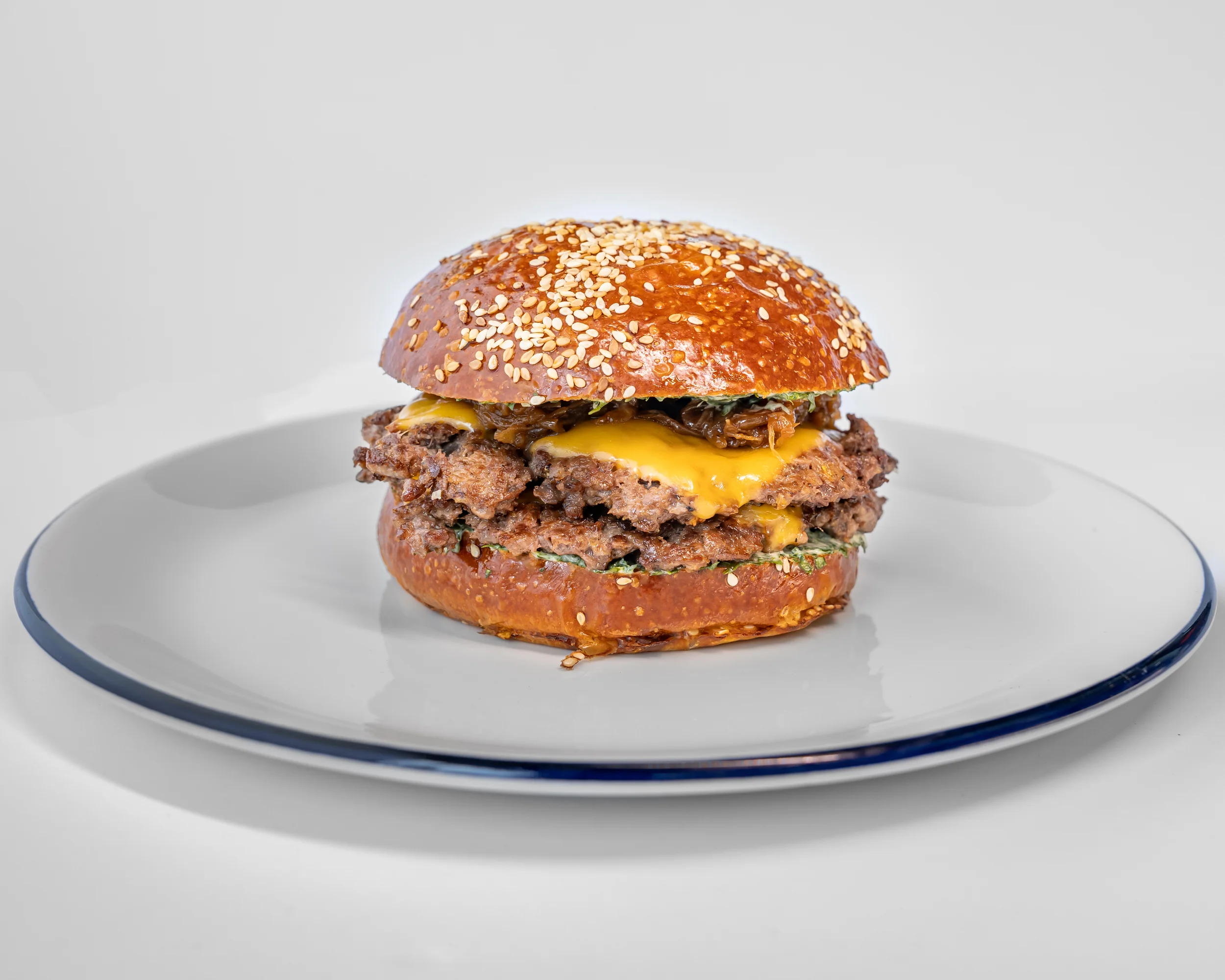 Juicy cheeseburger on a sesame seed bun