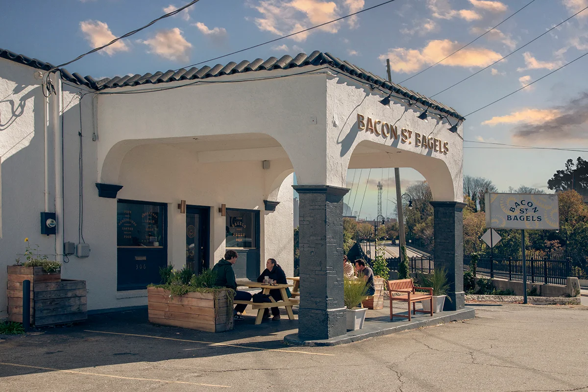 Charming bagel shop exterior with outdoor seating