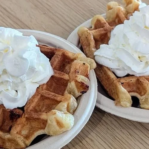 Belgian waffles topped with whipped cream