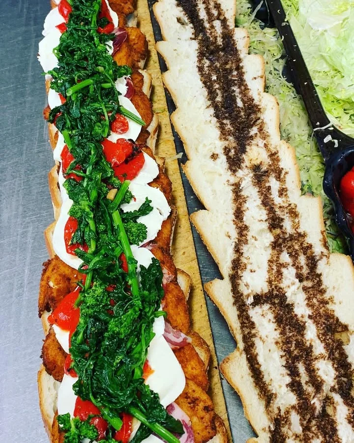 Italian chicken sandwich with broccoli rabe and roasted peppers
