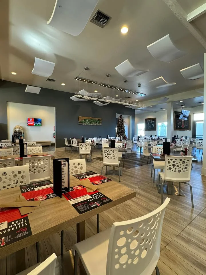 Modern restaurant interior with stylish seating and festive decor