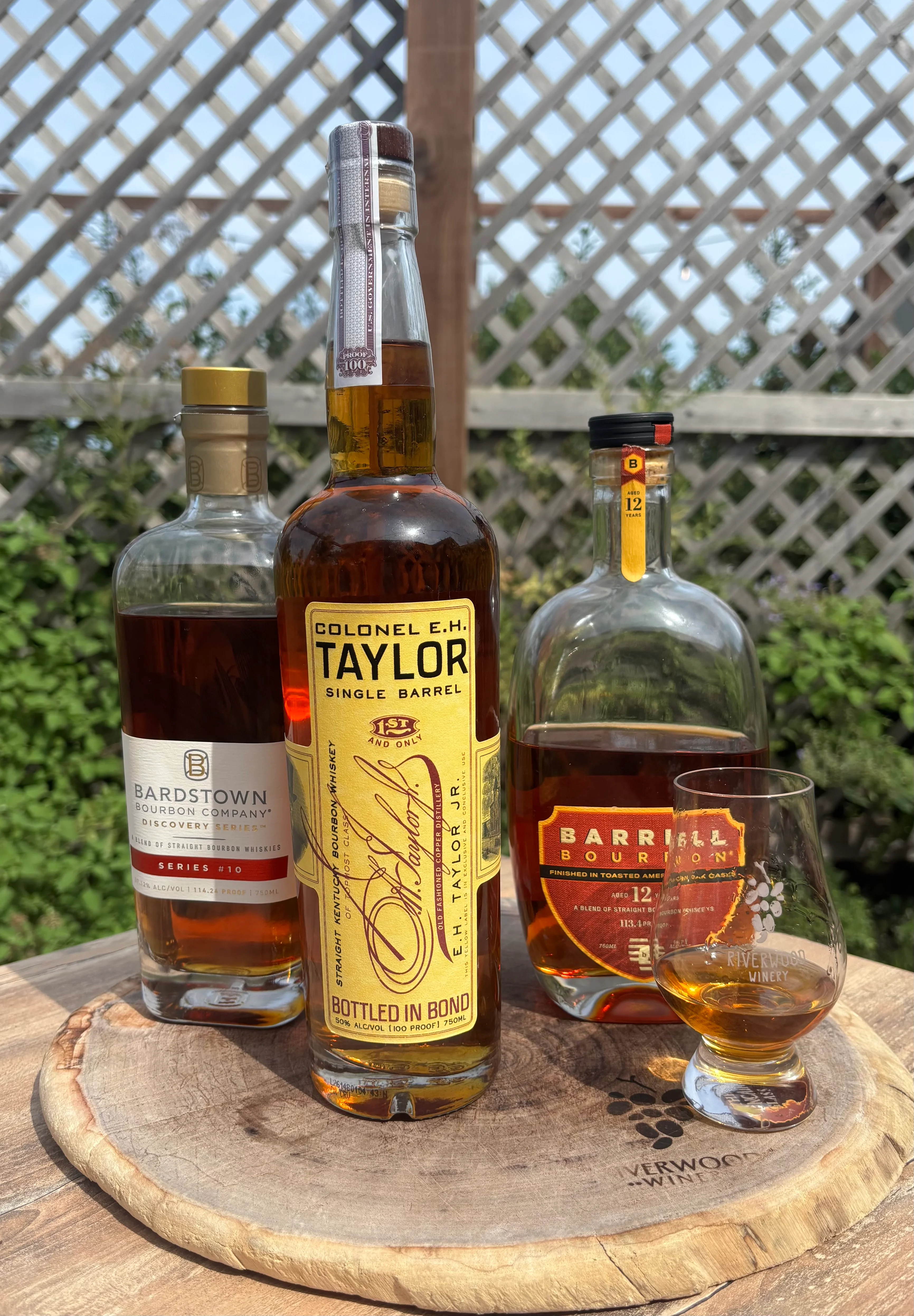 Selection of premium bourbons on a wooden table