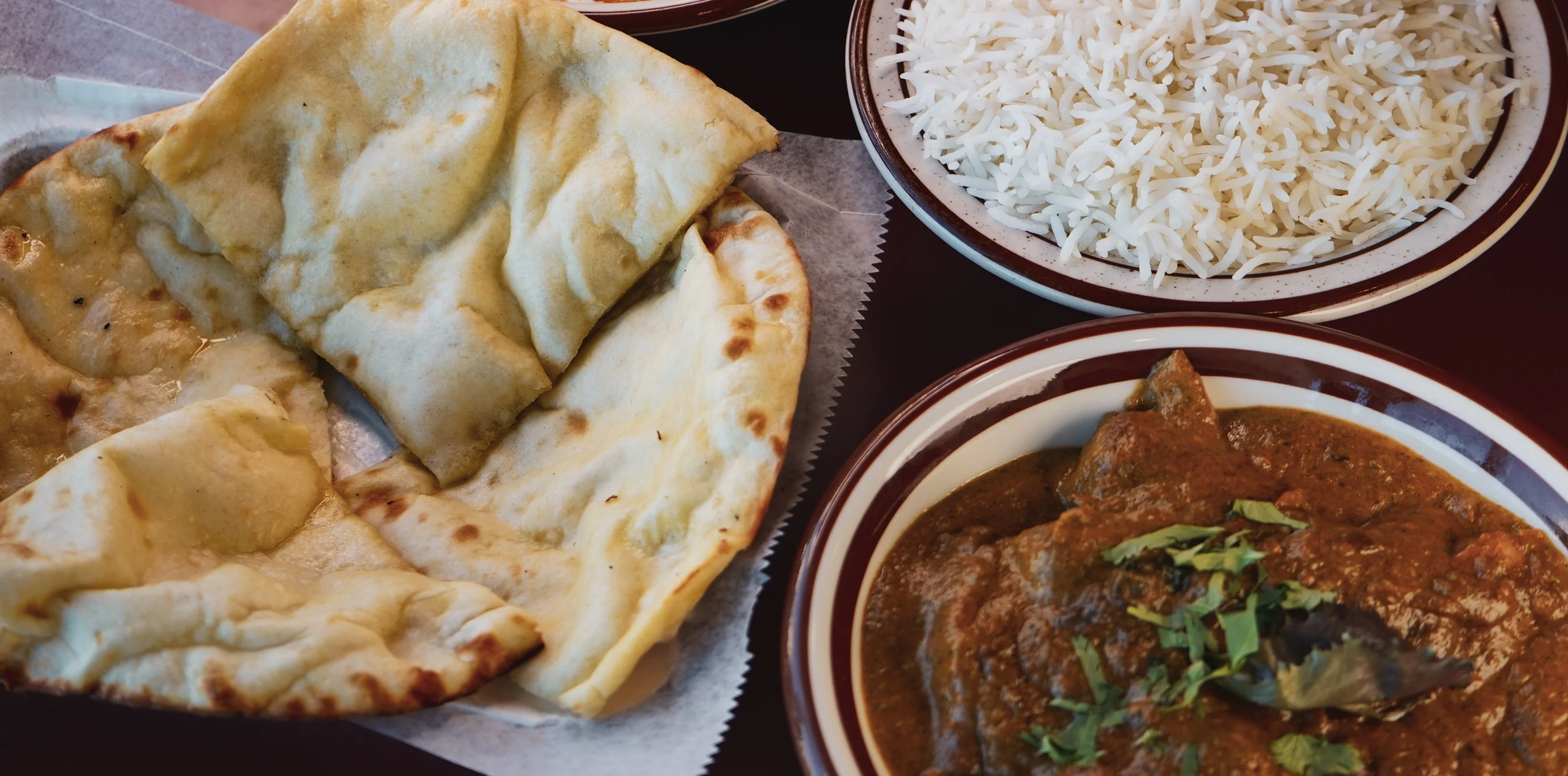 Indian butter chicken with naan and basmati rice